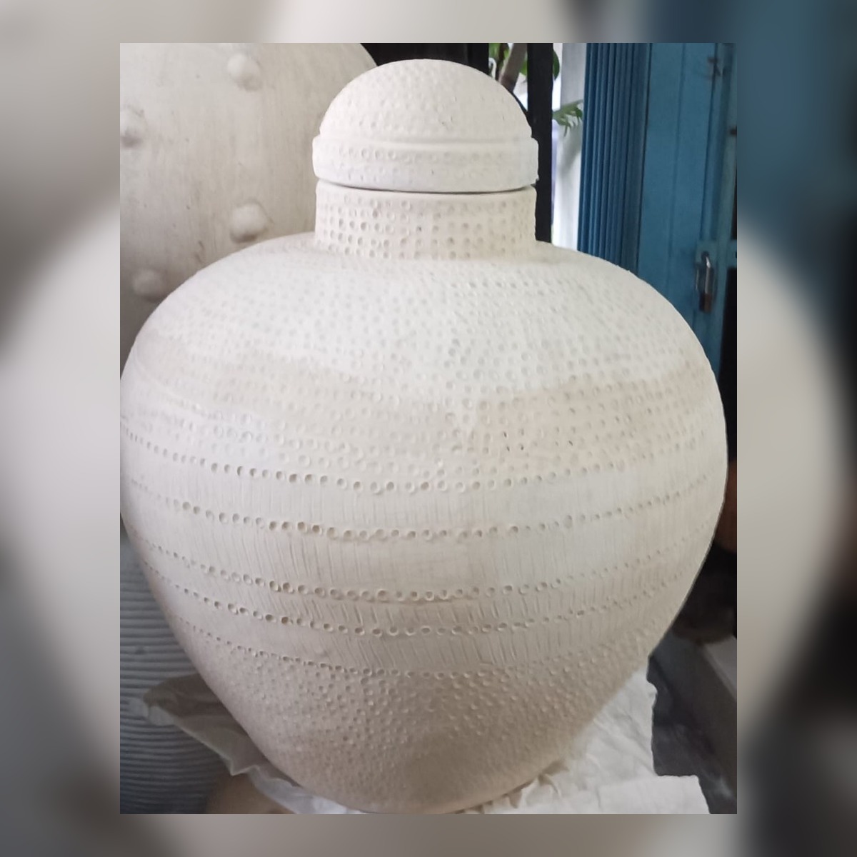 Large white textured vessel