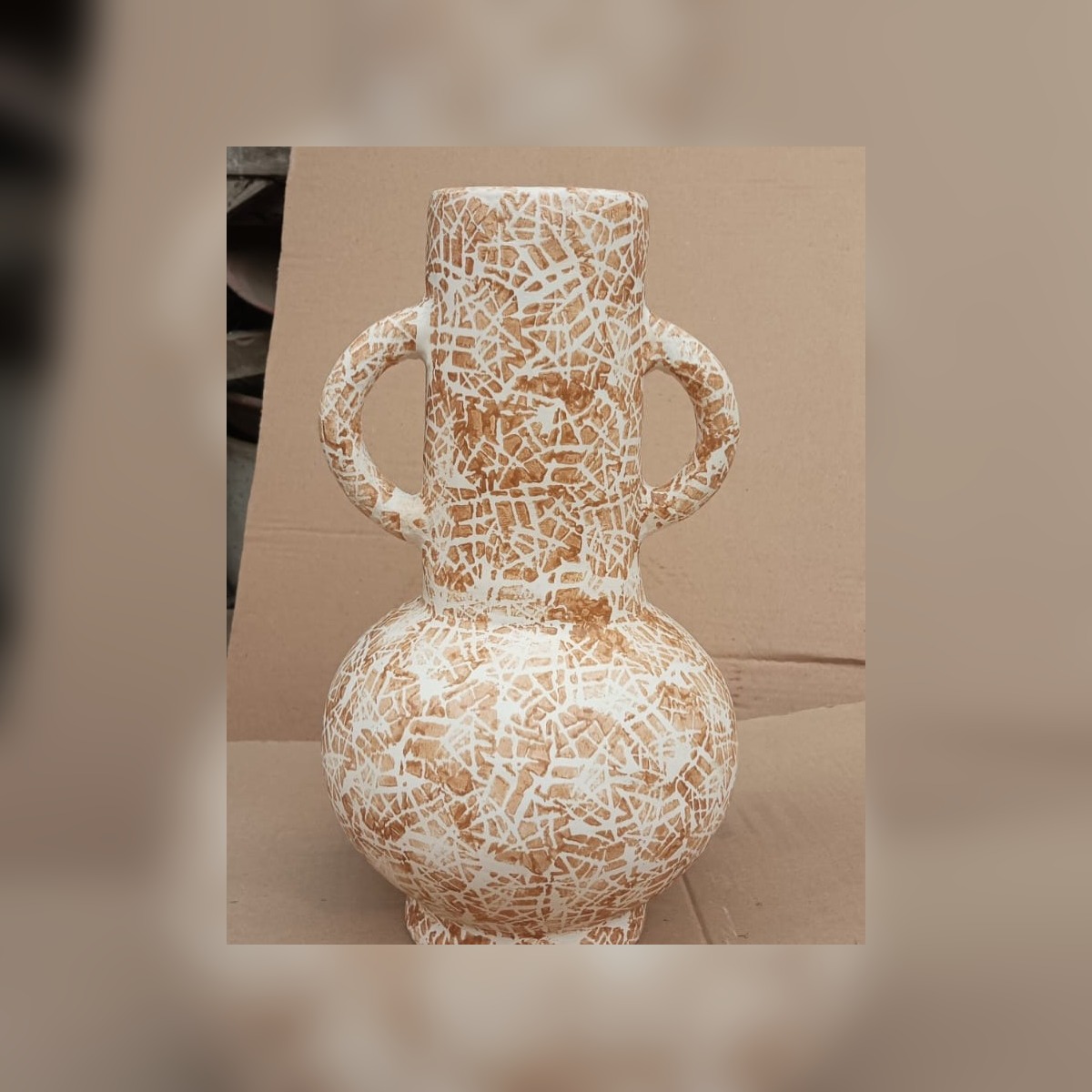 Tall handled ceramic vase with white crackle finish